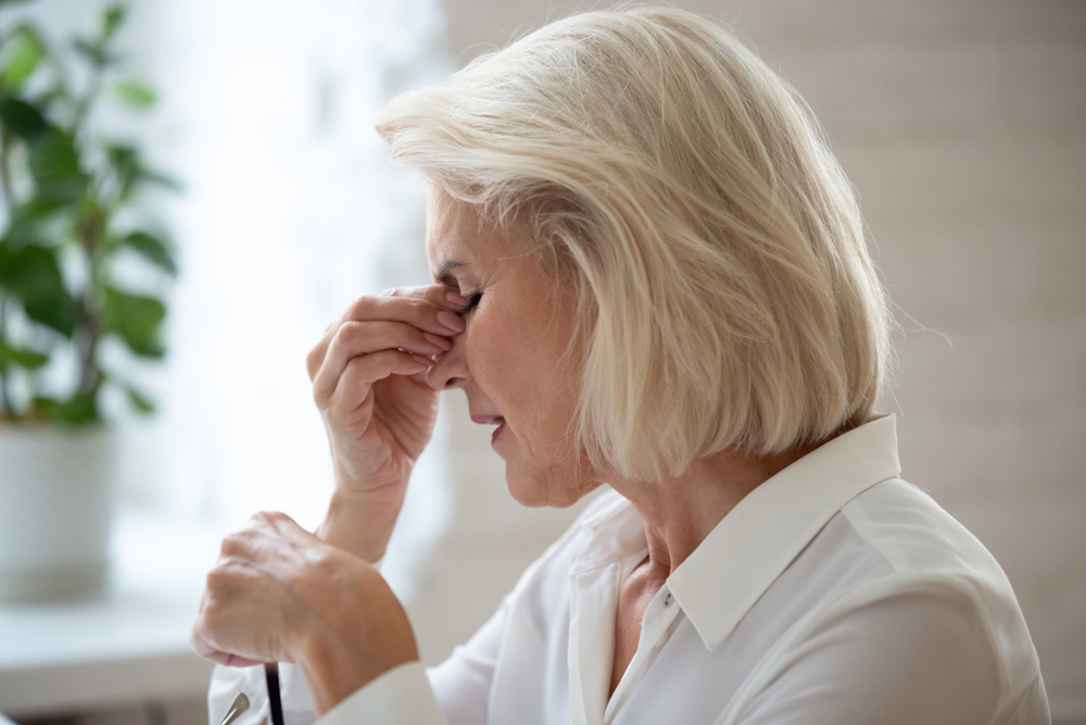 Close,Up,Of,Middle-aged,Blond,Woman,Taking,Off,Glasses,Reduces