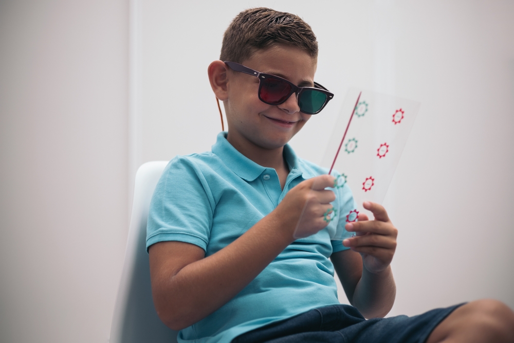 A,Child,Is,Subjected,To,Some,Convergence-divergence,Cards,With,Red