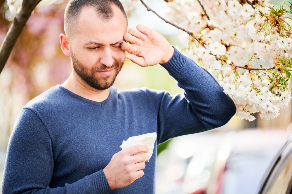 Man,Allergic,Suffering,From,Seasonal,Allergy,At,Spring,In,Blossoming