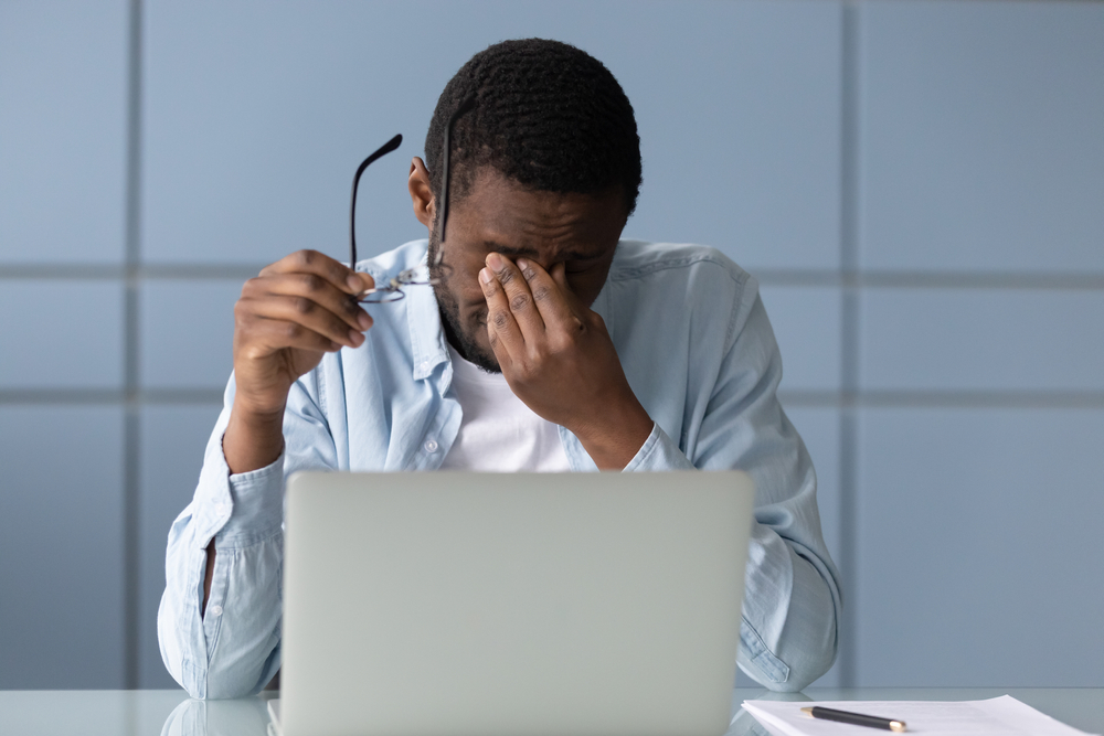Stressful,African,American,Businessman,Taking,Off,Glasses,,Suffering,From,Dry