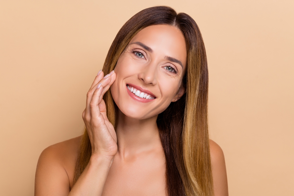 Portrait,Of,Attractive,Cheery,Long-haired,Woman,Touching,Soft,Skin,Lifting