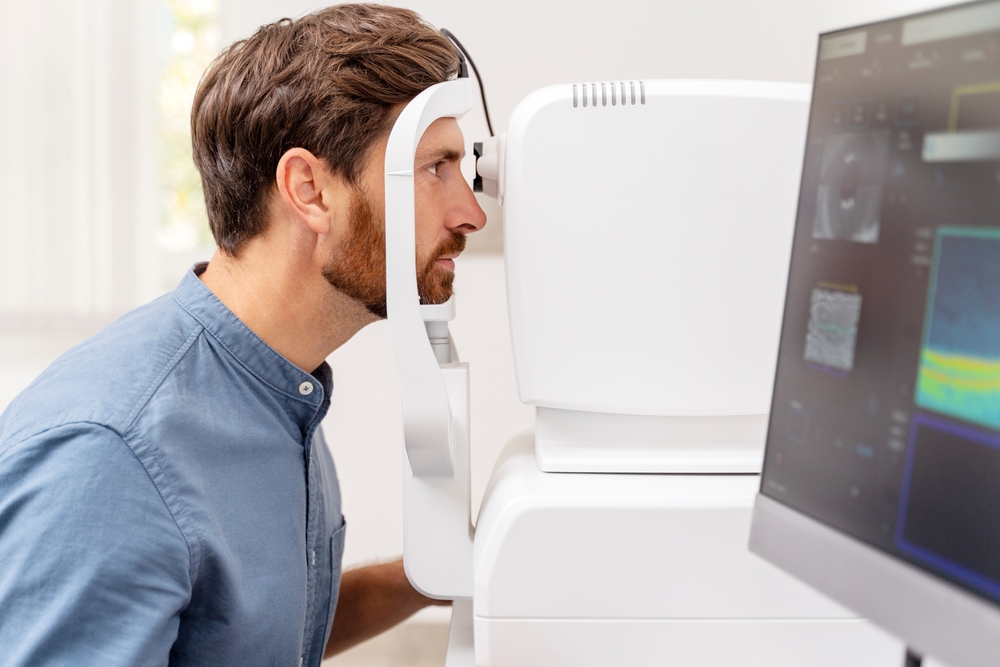 Young,Man,Fixing,In,A,Non-mydriatic,Retinal,Camera,Equipment.,Diagnostic