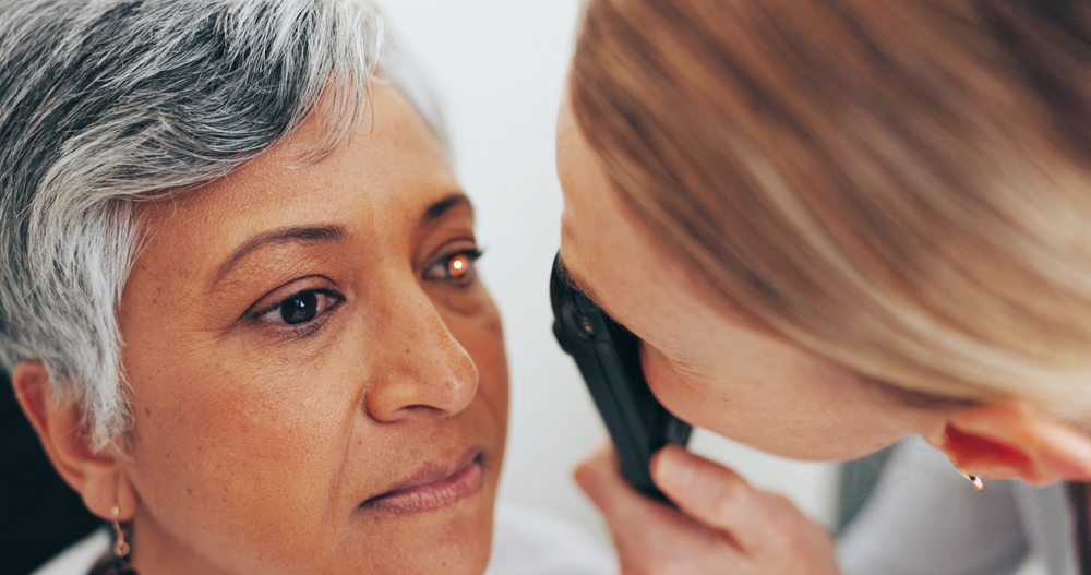 Optometrist,,Consulting,And,Retinoscope,With,Old,Woman,In,Clinic,For